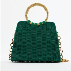 City Bag With Rattan Exterior. Lined Interior. Handles And Removable Metal Chain Crossbody Strap. Magnetic Closure. Green Shoulder Bag With Bamboo Handle For Shopping, Green Shoulder Bag With Bamboo Top Handle, Green Top Handle Shoulder Bag With Bamboo Handle, Green Bag With Bamboo Handle For Daily Use, Green Rectangular Bucket Bag With Detachable Handle, Chic Green Straw Bag For Shopping, Green Shoulder Bag With Detachable Handle For Beach, Green Tote Shoulder Bag With Bamboo Handle, Green Beach Bag With Detachable Handle