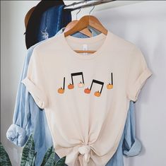 Pumpkin Music Note T-shirt Fall Music Teacher Tee Halloween - Etsy Fall Music-themed Graphic Print T-shirt, White T-shirt For Fall Concert, White T-shirt For Concerts In Fall, Fall Music-themed Cotton Tops, Boy Mom Shirt, Halloween Tee Shirts, Mom Graphic Tees, Mom Of Boys Shirt, Auntie Shirts