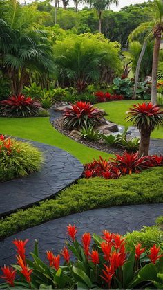 a lush green garden with red flowers and palm trees