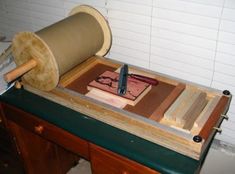 a wooden table topped with lots of different types of woodworking tools and materials on top of it