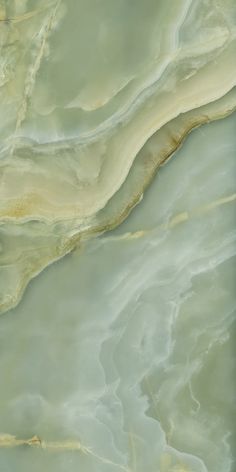 an aerial view of the surface of a large body of water that is green and brown