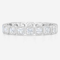 A modern update to the classic eternity band. Brilliant Asscher Cut Jewelry For Anniversary, Anniversary Jewelry With Asscher Brilliant Cut, White Gold Jewelry With Baguette Cut White Topaz, Octagon Brilliant Cut Diamond Ring, Brilliant Cut Octagon Diamond Ring, Timeless Octagon Diamond White Ring, Vvs Clarity Octagon Diamond Ring For Anniversary, Everyday Luxury Diamond Cut Cubic Zirconia Ring, Fine Jewelry In Platinum With Asscher Cut