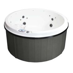 a large hot tub sitting on top of a white floor