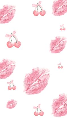 pink lipstick and cherries on a white background