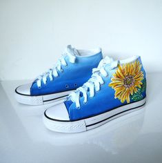 Custom Sunflower shoes. Handpainted design with Sunflowers on the blue ombre shoes. Acrylic paint on canvas shoes. Every size is possible. I use US size chart! Shoes are hand painted using High grade acrylic paint. I use a special textile paint designed to be flexible on fabric. The paint is water proof and fade proof. Prices depends on what model of shoes you will choose. Here we have art on non-brand shoes but I can use Coneverse or Vans. Let me know the style and your shoe size upon ordering Blue High-top Canvas Shoes For Summer, Sunflower Converse, Something Blue Shoes, Sunflower Shoes, Flower Converse, Converse Floral, Textile Paint, Acrylic Paint On Canvas, Floral Sneakers