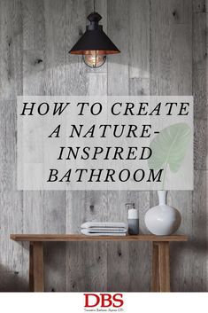 a wooden table with a lamp above it and the words how to create a nature - inspired bathroom