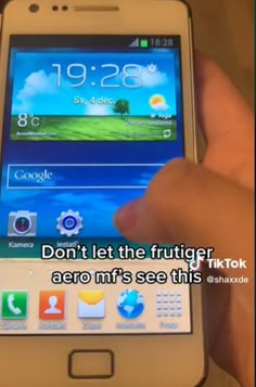 a person holding a smart phone in their hand with the caption don't let the frutiger, aero mr's see this