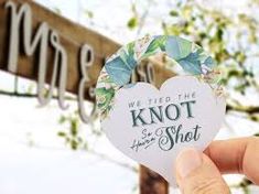 someone holding up a heart shaped sticker with the words, we need the knott to be shot