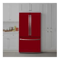 a red refrigerator freezer sitting in a kitchen next to white cabinets and cupboards