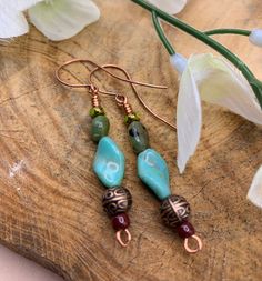 Twisted turquoise beads paired with green nugget chrysoprase and patterned copper bead for a unique pair of earrings.  Easy to be worn with nost outfits, dressy or casual, and this pair woud make a great gift for her. Bohemian Jade Earrings, Bohemian Drop Earrings With Gemstone Beads, Green Spiritual Jewelry With Dangling Beads, Spiritual Green Jewelry With Dangling Beads, Turquoise Beaded Earrings With Natural Stones, Bohemian Green Earrings With Natural Stones, Turquoise Dangling Beads Czech Glass Jewelry, Southwestern Green Beaded Dangling Earrings, Southwestern Green Beaded Earrings For Gift