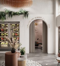 the entrance to an office with plants and potted plants