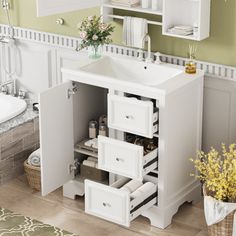 a white bathroom sink sitting under a mirror