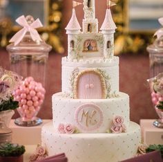 a princess castle cake with pink roses on top