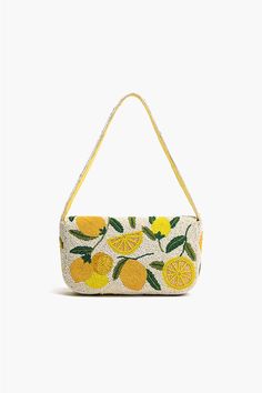 Luxe Embellished shoulder bag Beautifully hand-beaded lemons in bright and butter yellow Embellished shoulder straps Magnetic Button closure Lined interiors with zip pocket Size: 10" X 5.5" X 2" Handmade by Artisans Embrace the whimsical charm and let your style shine with the Make a Lemonade Shoulder Bag. A luxurious and enchanting accessory that adds a touch of zest to your ensemble. Crafted with meticulous attention to detail, this shoulder bag is adorned with beautifully hand-beaded lemons i Lemon Clothes, Sprinkle Sprinkle, Make Lemonade, Leopard Bag, Yellow Hues, Floral Purse, Butter Yellow, Mini Pouches, Small Pouches