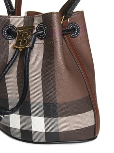 >polyurethane, 55% Synthetic->polyester, 25% Natural (veg)->cotton, 20% | Burberry Women's Tb Bucket Bag in Brown | SS24 Burberry Tote, Burberry Handbags, Ladies Handbags, Burberry Women, Sneaker Wedge, Shopping Tote, Shirts For Women, Luxury Retail, Functional Design