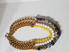 "Beautiful vintage Murano glass beads and dyed jade beads create a one of a kind necklace. Gold rings add shine to the top half of each strand. The necklace has a toggle clasp. ●Dimensions: L:22\" ●Linda's Designers Group features a collection of unique fine china, luxury estate sale handbags, vintage statement jewelry and handmade 'one of a kind' jewelry. We will gladly provide additional images or information, contact us through this site or our Facebook page. Follow us on Facebook and Instagr Luxury Glass Jewelry With Large Beads, Luxury Glass Jewelry With Round Beads, Czech Glass Large Beads Multi-strand Jewelry, Multi-strand Czech Glass Jewelry With Large Beads, White Glass Necklace With Colorful Beads, Handmade Multi-strand Glass Jewelry, Glass Multi-strand Jewelry With Large Beads, Multi-strand Glass Beaded Jewelry, Multi-strand Glass Bead Jewelry