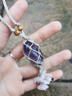 Handmade macrame car charm decoration with amethyst tumble stone and rose quartz beads ️ All jewellery and accessories are made by me :) AMETHYST Chakra alignment: third eye Birthstone: Pisces, Virgo, Aquarius and Capricorn Amethyst is an extremely calming stone known to relax the mind, relieve stress and help anyone that's feeling low. It is known as a master healer and highly cleansing. It is a really effective soothing stone also used for psychic and spiritual development. Used to block geopathic stress and negative energy. Amethyst is known to boost the immune system and also treating bacterial infections. It's said to help treat skin conditions including acne. ROSE QUARTZ Birthstone: Taurus Chakra Alignment: Heart Rose Quartz works with the Heart Chakra. It is highly known as the ston Hippie Style Purple Jewelry For Gift, Purple Hippie Jewelry For Gifts, Purple Hippie Jewelry For Gift, Adjustable Bohemian Lavender Crystal Necklace, Adjustable Amethyst Crystal Necklace Spiritual, Spiritual Healing Crystal Necklace With Macrame, Virgo Aquarius, Macrame Crystal Car Charm, Pisces Virgo