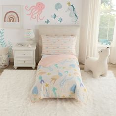 a child's bedroom decorated in pastel colors