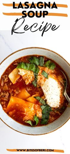 a bowl of lasagna soup with meat, cheese and spinach in it