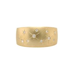 a gold ring with stars and diamonds on the inside, set in 18k yellow gold