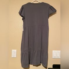 Gray Ruffled Dress Fits Loose. Size Small (4-6). Never Worn New With Tags. Brand Is Time And Tru. Casual Midi Dress With Flutter Sleeve And Ruffle Hem, Cotton Midi Dress With Ruffles And Short Sleeves, Casual Cotton Midi Dress With Flutter Sleeves, Casual Dresses With Flutter Sleeve And Ruffle Hem, Relaxed Fit V-neck Dress With Ruffles, Casual Ruffle Sleeve Day Dresses, Relaxed Fit Midi Dress With Ruffles, Cotton Midi Dress With Ruffle Hem And Short Sleeves, Casual Flowy Gray Dress