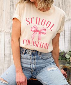 The Coquette Bow School Counselor Shirt is a perfect gift for school counselors. This back-to-school teacher tee is both stylish and thoughtful. Show your appreciation with this charming counselor gift. Product Description: ⇝ Bella and Canvas Brand Shirts ⇝ Unisex Adult Sizing ⇝ Rolled Sleeves in pictures are for styling purposes only ⇝ Props used in photos for are NOT included with purchase ⇝ Please consult the listing image for information regarding the sizes available for the T-shirt. ⇝ When School Counselor Tshirt Ideas, Counselor Shirt, School Counselor Tshirt, School Counselor Confidentiality Sign, Licensed Professional Counselor, Elementary School Counselor, Counselor Gifts, Teacher Tees, School Counselor