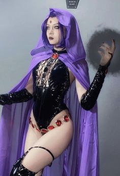 a woman in a purple costume is posing for the camera