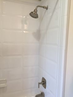 the shower head is attached to the wall