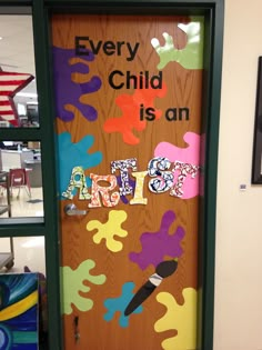 a door decorated with colorful paint and the words every child is an artist