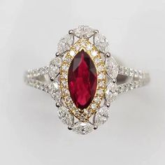 an oval shaped ruby and diamond ring