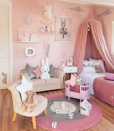 a child's bedroom decorated in pink and white