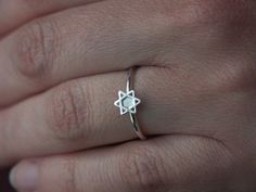 This ring is handmade from 1.5mm sterling silver wire with a 7mm Star of David cameo. The ring is perfect for stacking. Available in a shiny finish (Polished), or a matte finish (Brushed) or an oxidized and brushed finish (for a rustic look). The ring will be sent in a box, ready to be given as a gift. Made to order in your size within 3-5 business days. Ring size can be specified using halves and quarters as I hand make every ring, Sizes can be 2 to 12 With all possible increments in between. W Nickel-free Star-shaped Promise Ring, Nickel-free Sterling Silver Star Ring, Adjustable Sterling Silver Stackable Star Rings, Sterling Silver Star Of David Ring Gift, David Ring, Stack Ring, Stackable Ring, Ring Sizes, Star Of David