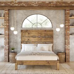 a large bed sitting under a window next to a wooden headboard and foot board