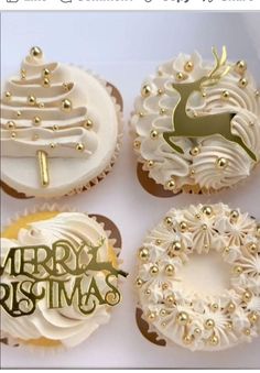 four cupcakes decorated with white frosting and gold decorations, one has a merry christmas sign