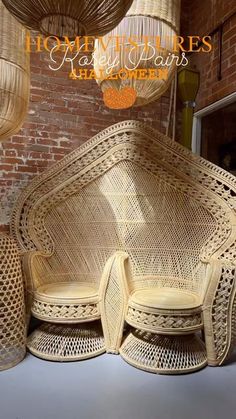 three wicker chairs sitting next to each other in front of a brick wall and ceiling