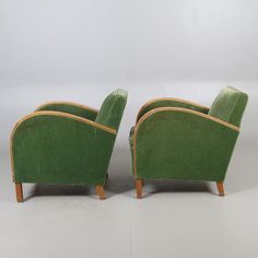 two green chairs sitting next to each other