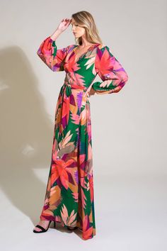 A printed woven maxi dress featuring surplice neckline, true wrap with tie and long sleeve Details: Self : 100% Polyester Lining : 100% Polyester Size & Fit - Model is 5`8" And Wearing Size Small- Measurements Taken From Size Small- Approx. Length: 60" Green V-neck Maxi Dress With Tie Waist, Green Surplice Neckline Dress With Tie Waist, Green Dress With Tie Waist And Surplice Neckline, Vibrant Print V-neck Maxi Dress For Brunch, Green V-neck Wrap Dress For Spring, Green V-neck Wrap Dress With Tie Waist, Green Tie Waist Maxi Wrap Dress, Green Maxi Wrap Dress With Tie Waist, Green Maxi Length Wrap Dress With Tie Waist