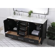 a bathroom vanity with two sinks and mirrors on the wall next to a potted plant