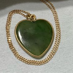 14kt Yellow Gold Jade Heart-Shaped Vintage Art Deco Pendant Necklace Jade Is An Ancient Stone That Has Historically Been Used To Attract Love, This Necklace Is The Epitome Of A Love Token 16" Chain Has Cartouche Marked Sylkay 14kt Vintage, Probably 1930's Art Deco. There Is Another One Of These Listed Elsewhere For 9x The Price Of This One! Chain Is Delicate Looking But Sturdy Heart Pendant Is Quarter Sized Outlined In A 14kt Gold Frame See Pics Gift Wrapping Available, Message Me At Purchase Bin 723 Green 14k Gold Heart Jewelry, Green Heart-shaped 14k Gold Jewelry, Green 14k Gold Heart Pendant Necklace, Green Heart Pendant Jewelry For Formal Occasions, Green Heart-shaped Jewelry For Formal Occasions, Green Heart-shaped Formal Jewelry, Formal Green Heart Pendant Necklaces, Formal Green Heart Pendant Necklace, Art Deco Pendant Necklace