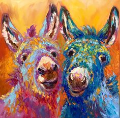 two colorful llamas are standing next to each other in front of an orange background