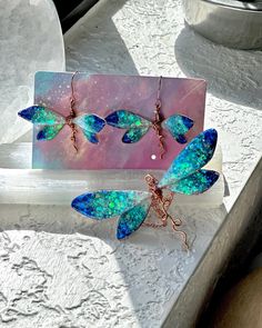 ❤️100% Handmade Copper Wire & UV epoxy Ocean Ombre Dragonfly Pendant Necklace and earrings!  This is a 100% Handmade Dragonfly pendant necklace and earrings were designed and made by me, Elle!  I make these Dragonflies using pure copper wire which I hand shape into each wing, even adding the veins within the wing depending on the colors chosen. After the Dragonfly sections are made I fill them with UV epoxy, adding natural Mica powder to change the colors.  The necklace pendant is about 3" wide Iridescent Butterfly-shaped Handmade Jewelry, Handmade Iridescent Butterfly Jewelry, Handmade Iridescent Jewelry In Butterfly Shape, Green Dragonfly Jewelry For Gifts, Green Dragonfly Jewelry Gift, Green Dragonfly Jewelry As A Gift, Iridescent Butterfly-shaped Jewelry Gift, Iridescent Butterfly Shaped Jewelry Gift, Iridescent Butterfly Jewelry For Gifts