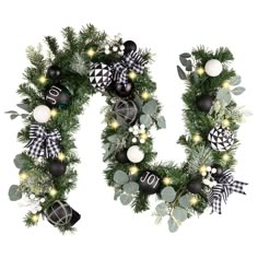 the letter u is decorated with ornaments and greenery