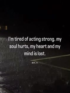 a person walking in the rain with an umbrella over their head and text that reads i'm tired of acting strong, my soul hurts, my heart and my mind is lost