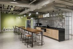 the interior of an office with tables and chairs