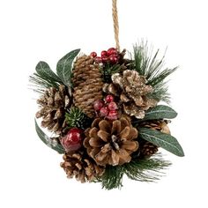 a hanging ornament with pine cones and berries