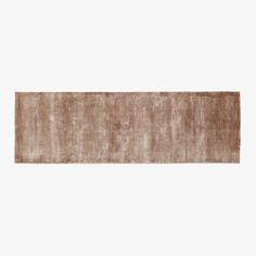 a brown rug on a white background