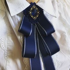 Navy blue bow brooch tie for women. Handmade women bow tie. Color : navy. Length: 8.5 Inches Width: 4.0 Inches DISCLAIMER: Some items may contain small parts that may pose a choking hazard for small children should they come loose. Please supervise children at all times while wearing any item purchased from NataliBrooches. The buyer assumes all responsibility at the time of purchase. If you have any questions, do not hesitate to contact me and I will get back to you right away. If you have speci Navy Bow Tie, Navy Ribbon, Tie Crafts, Ties Mens Fashion, Tie For Women, Tie Women, Bow Brooch, Black Bow Tie, Handmade Valentine