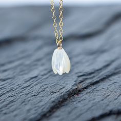 Beautiful hand carved Mother of Pearl Pikake bead necklace. These Pikake are not plastic, they are real carved mother of pearl. This Pikake necklace is so dainty and pretty to look at! Check out the matching earrings here: https://www.etsy.com/listing/1028920579/single-pikake-mother-of-pearl-earring Your choice of sterling silver or gold fill - they will not tarnish and can even get wet. Each Pikake is hand carved and may vary slightly one from the next in size and details. Bridesmaid Necklace Gift, Pearl Bangle, Jewelry Bridesmaid, Mother Of Pearl Necklace, Pearl Earring, Bridesmaid Necklace, Necklace Gift, Gold Plated Jewelry, Jewelry Plate