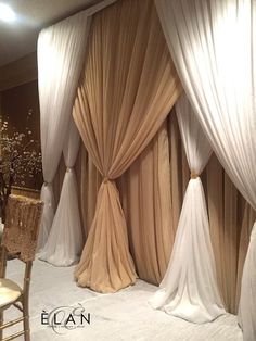 an image of a wedding stage setting with drapes