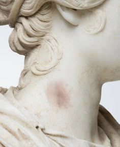 a close up of a statue of a woman's head